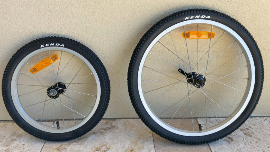 Two bike wheels against a wall