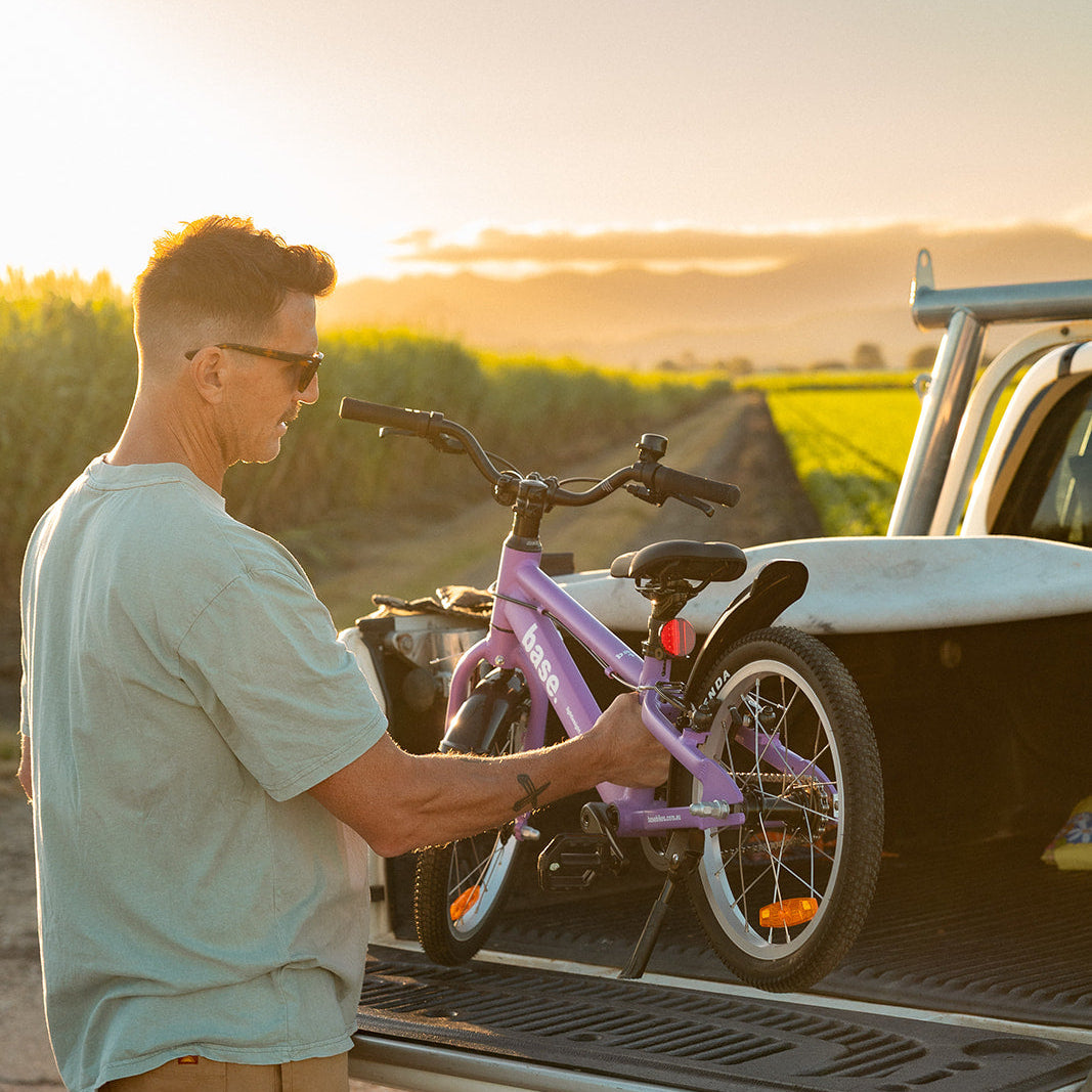 Dad lifting 16 inch bike