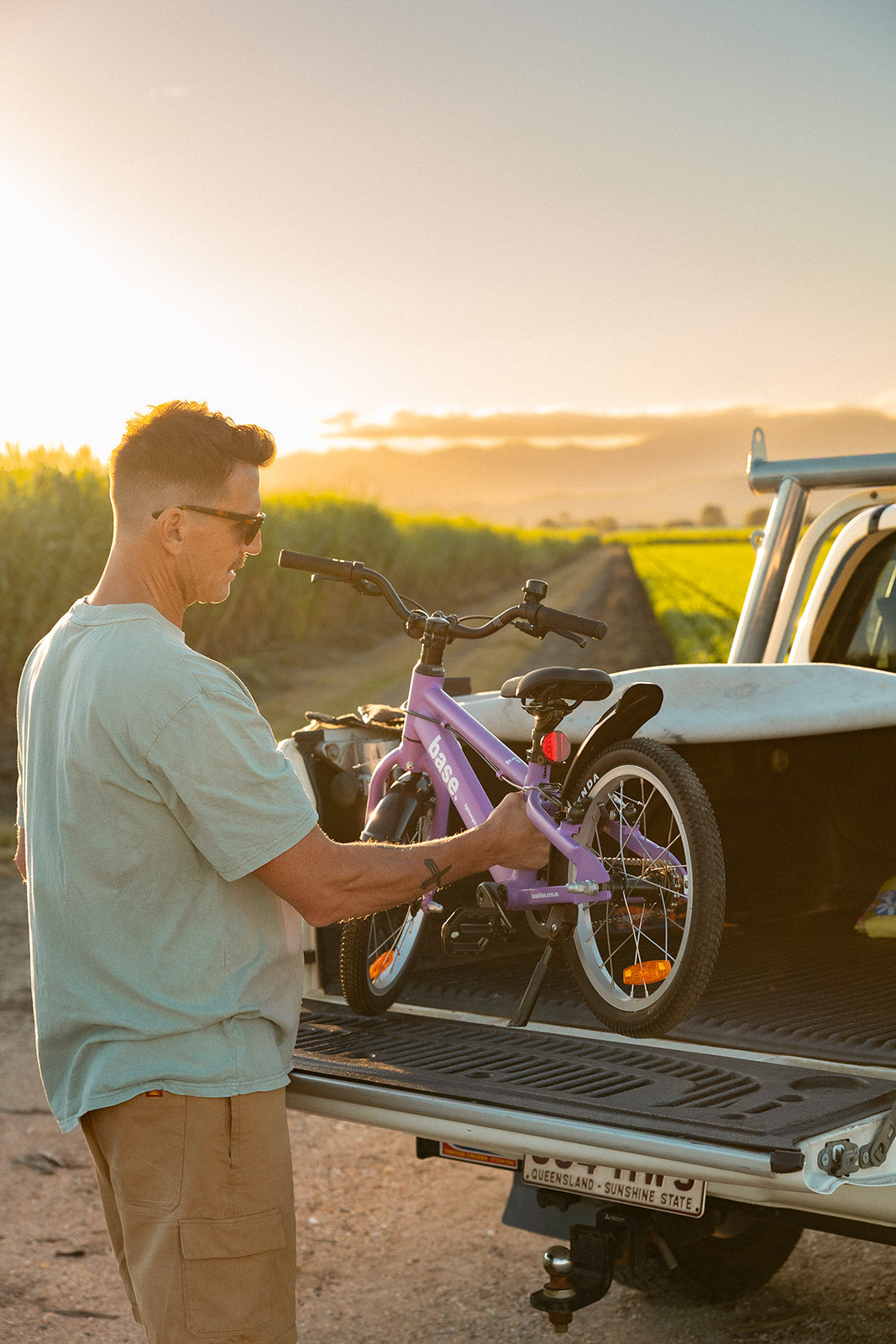 Dad lifting 16 inch bike