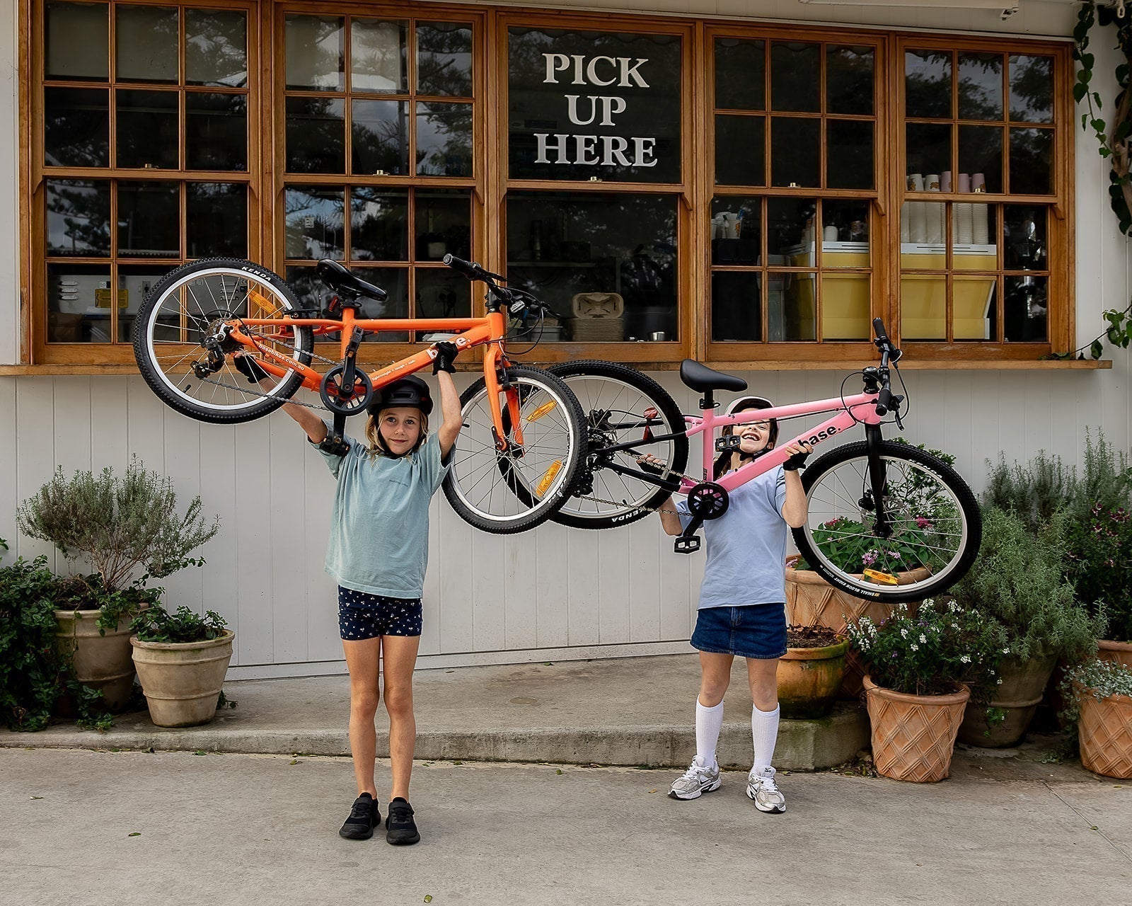 Kids lifting light bikes