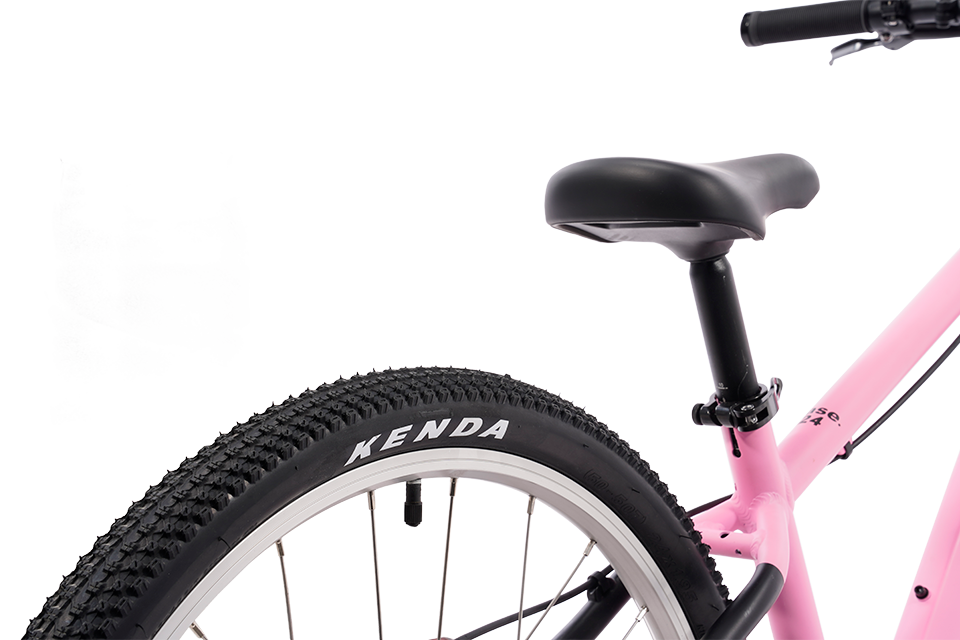 Close-up of a bicycle wheel with Kenda tire on a white background
