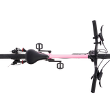 Pink and black bicycle on a white background view from above