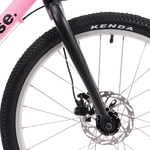 Close-up of a pink bicycle wheel with 'base' branding and Kenda tire.