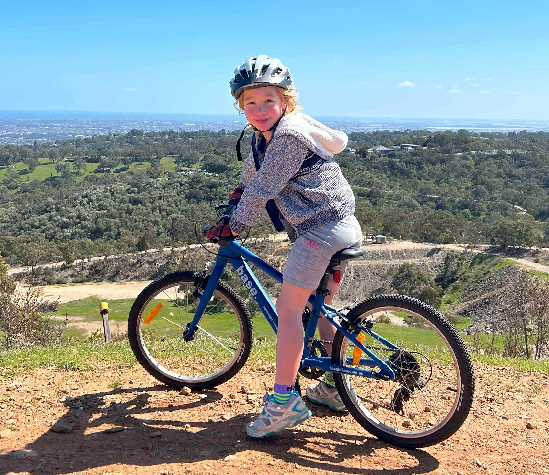 Boy on bike turning towards camera