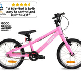 Pink kid's bike with 'Two Wheeling Tots' logo and Good Design Award badge on a white background
