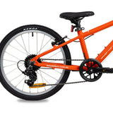 Red base girls 20 inch kids bike zoomed in on rear of bike to show Shimano gears, with white background