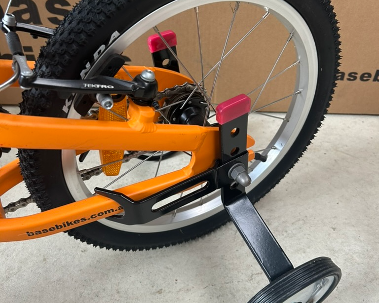 Training wheels fitted to 16 inch bike side view
