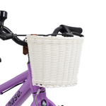 White kids bike basket diagonal view on a purple bike