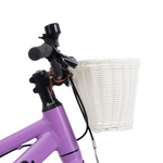 White kids bike basket side view on a purple bike