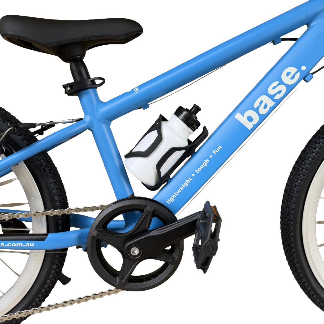Close-up of a blue children's bicycle frame with black components, a white water bottle, and visible 'base.' branding on the downtube against a white background.